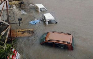 Stranded cars are seen in floodwater caused by Typhoon Halong in Kochi