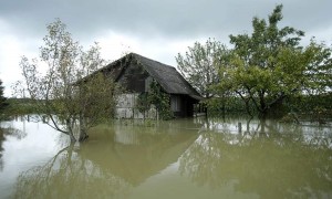 A view of a house in the midst of floodwater in Zazina village
