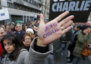 A woman with "I'm Charlie" written on her hand takes part in a Hundreds of thousands of French citizens solidarity march (Marche Republicaine) in the streets of Paris