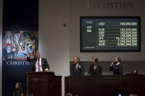 Auctioneer Jussi Pylkkanen drops the gavel as he sells Pablo Picasso's "Les femmes d'Alger (Version 'O')" (Women of Algiers) at Christie's Auction House in the Manhattan borough of New York