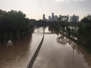 Flood waters cover Memorial Drive along Buffalo Bayou in Houston