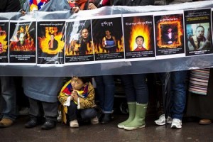 File photo of a child gesturing at feet of protesters during solidarity march from Chinese Consulate to UN Headquarters in support of Tibet in New York