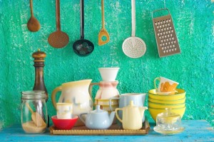 collection of vintage kitchenware, green wall  background