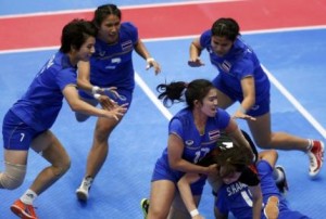 Thailand's players tackles Japan's Kaneko during their women's preliminary kabaddi match at the 17th Asian Games in Incheon